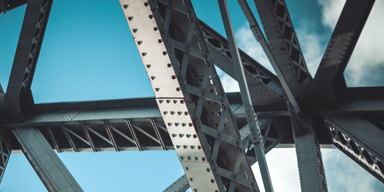 Close up photo of metal bridge supports