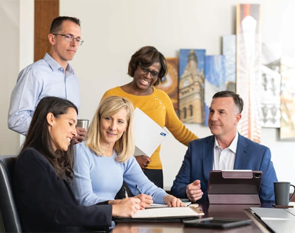 Candid photo of Corporate Resource Group associates meeting in a conference room