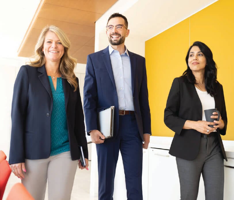 Associates walking into a conference room