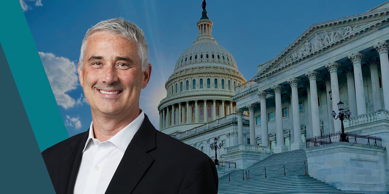 Headshot of Michael Antonelli with the capital building in the background.