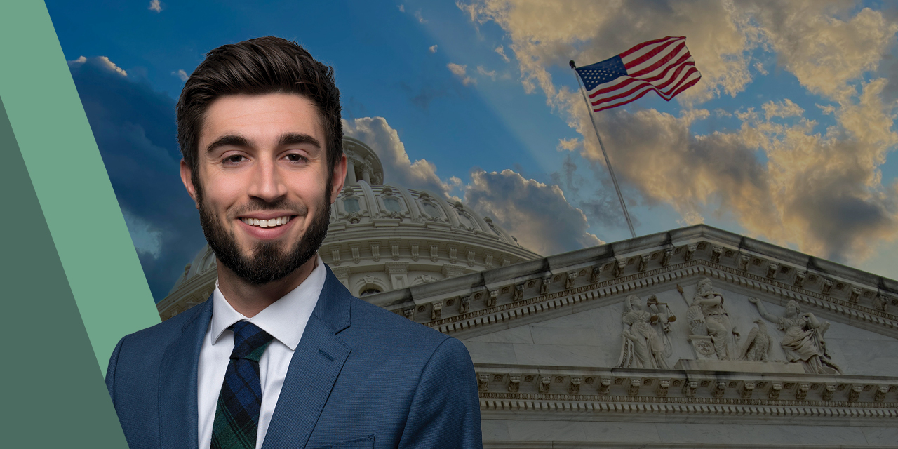 Ross Mayfield headshot with a building in the background and an American flag.