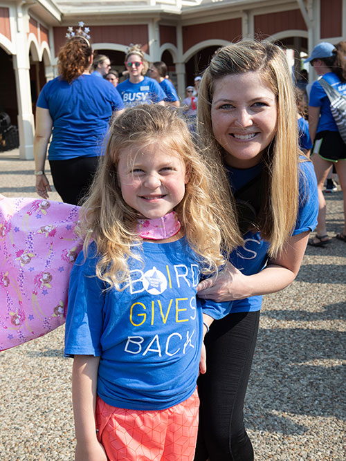 Woman and girl wearing Baird Cares tshirts.
