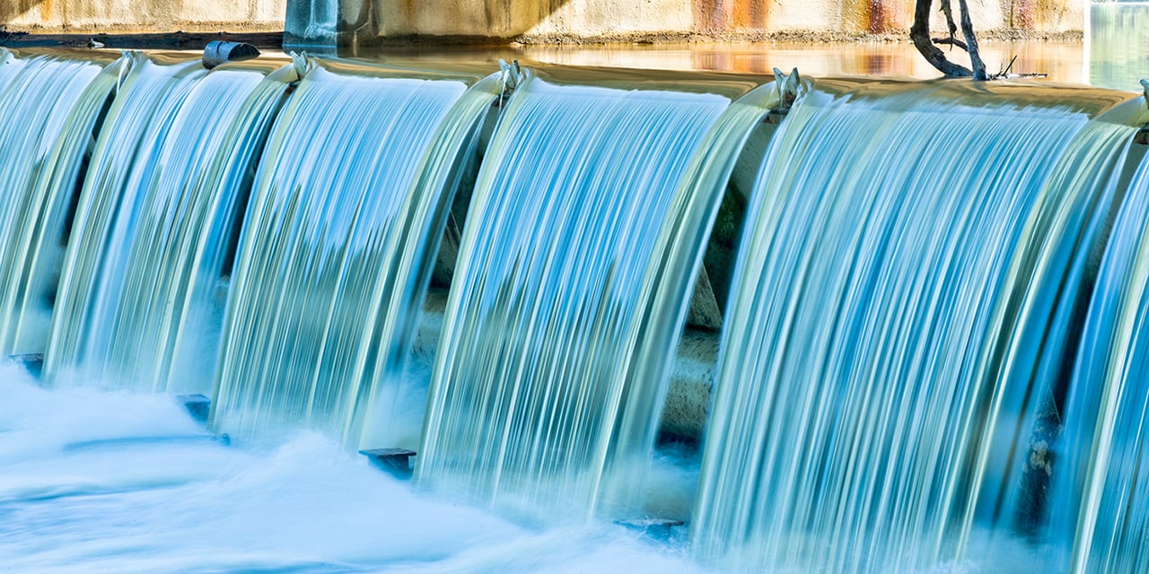 Water flowing over a dam