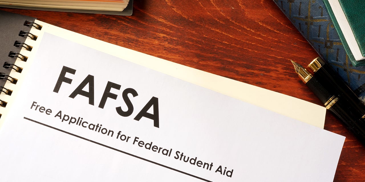 FAFSA paperwork on a desk.