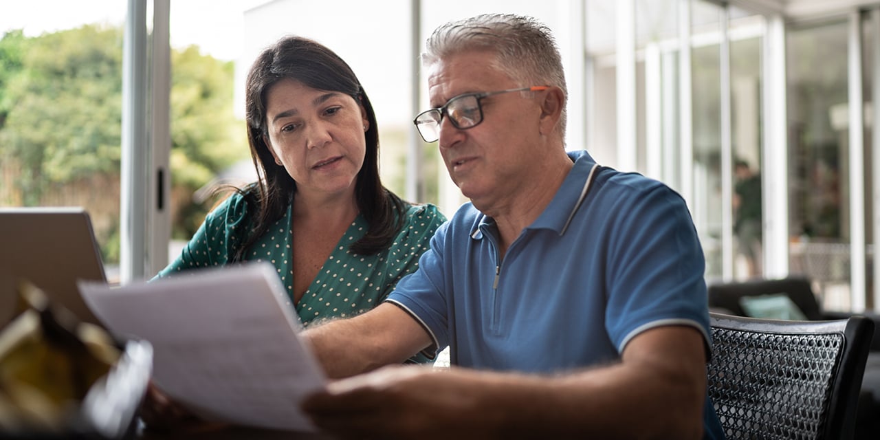 Couple reviewing paperwork.