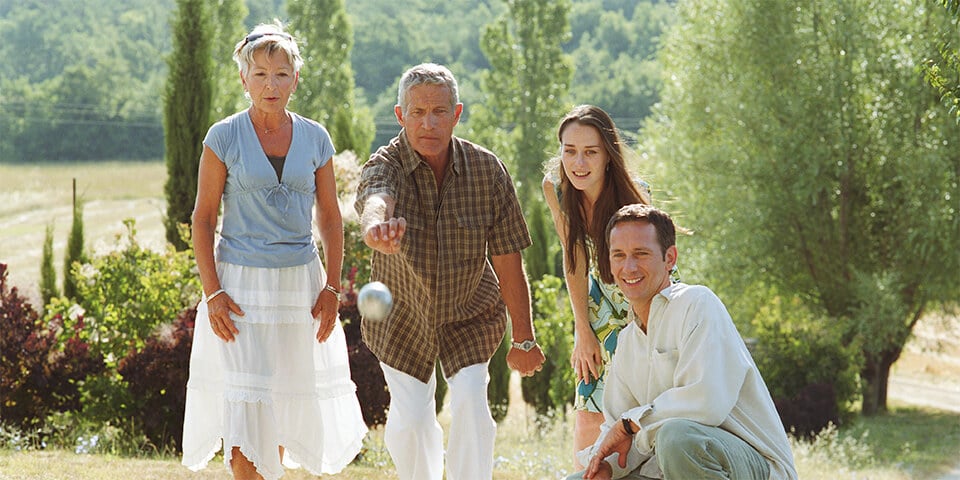 Family playing bocce ball.