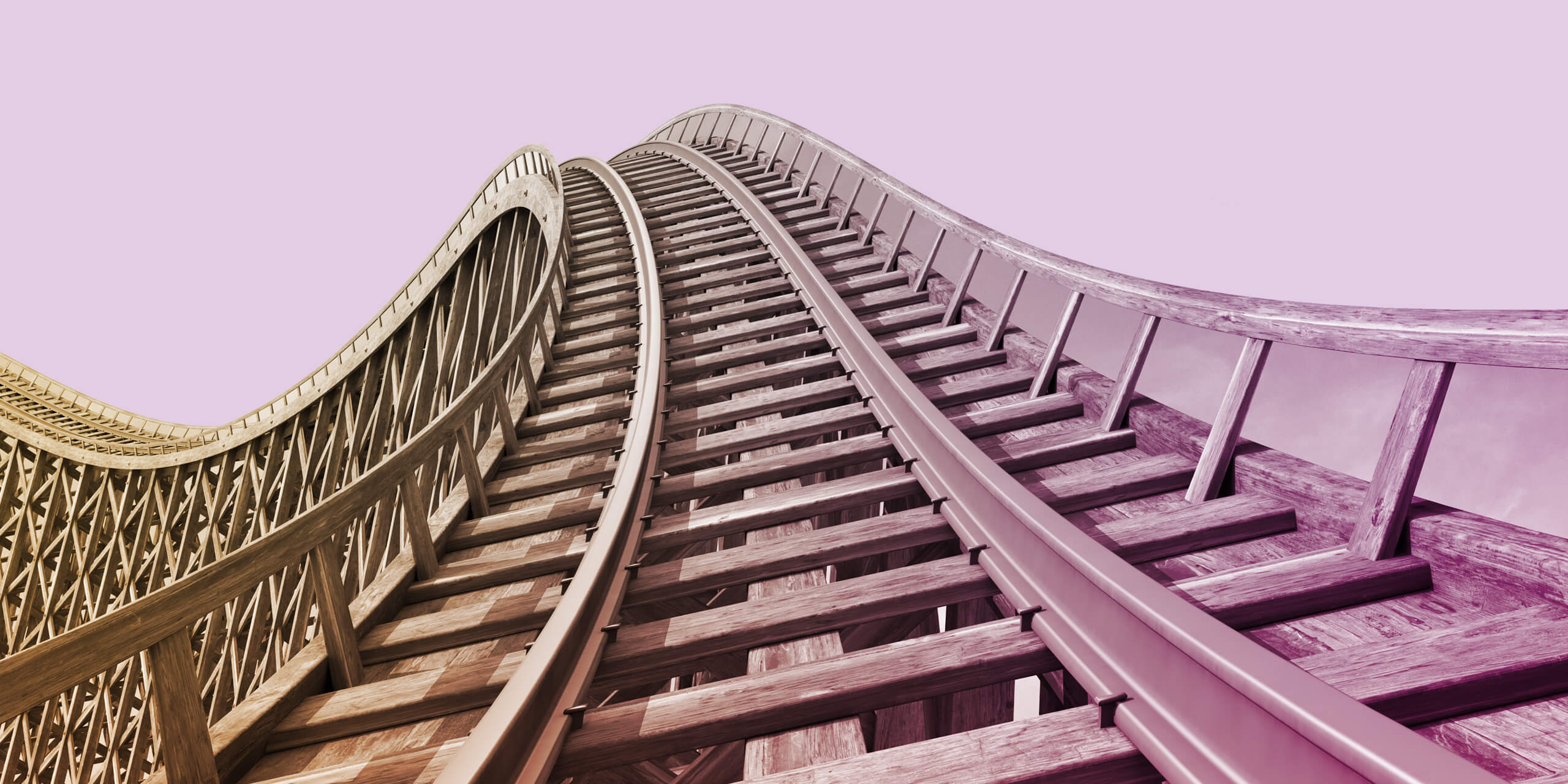 Wooden roller coaster track with blue sky in the background