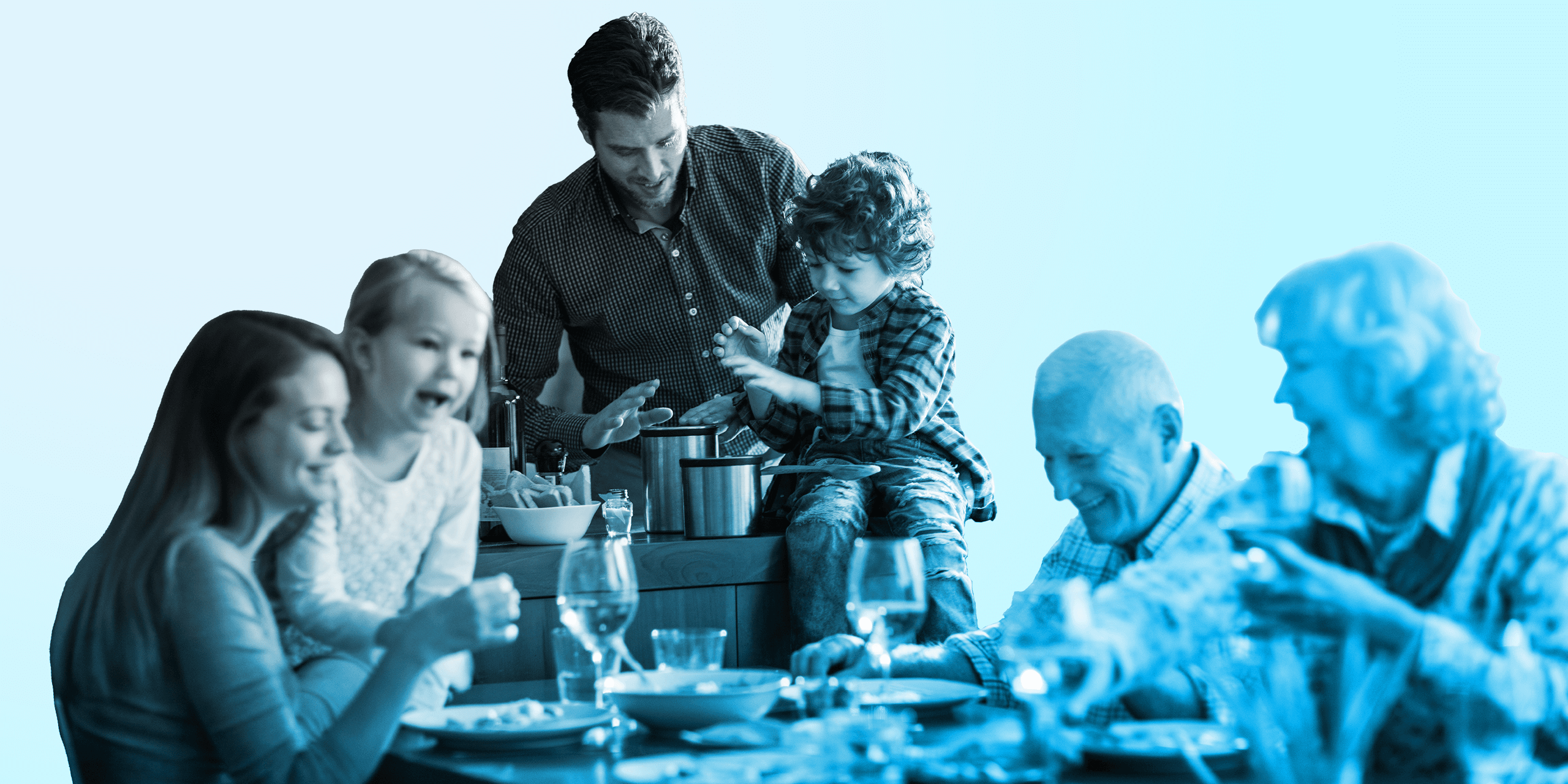 Multi-generational family preparing meal