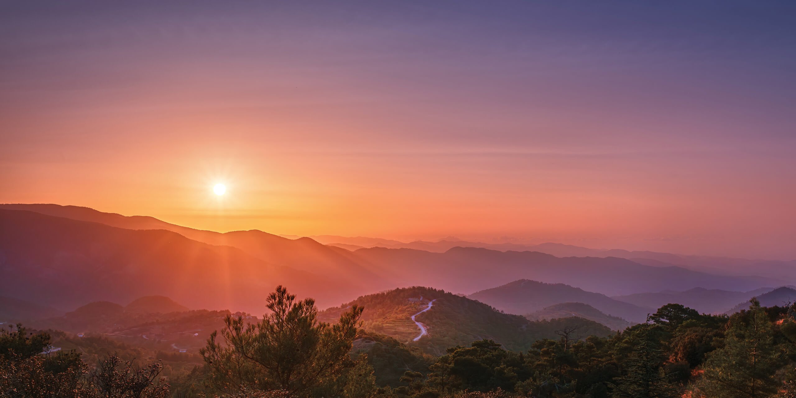 Sunset over mountainous landscape