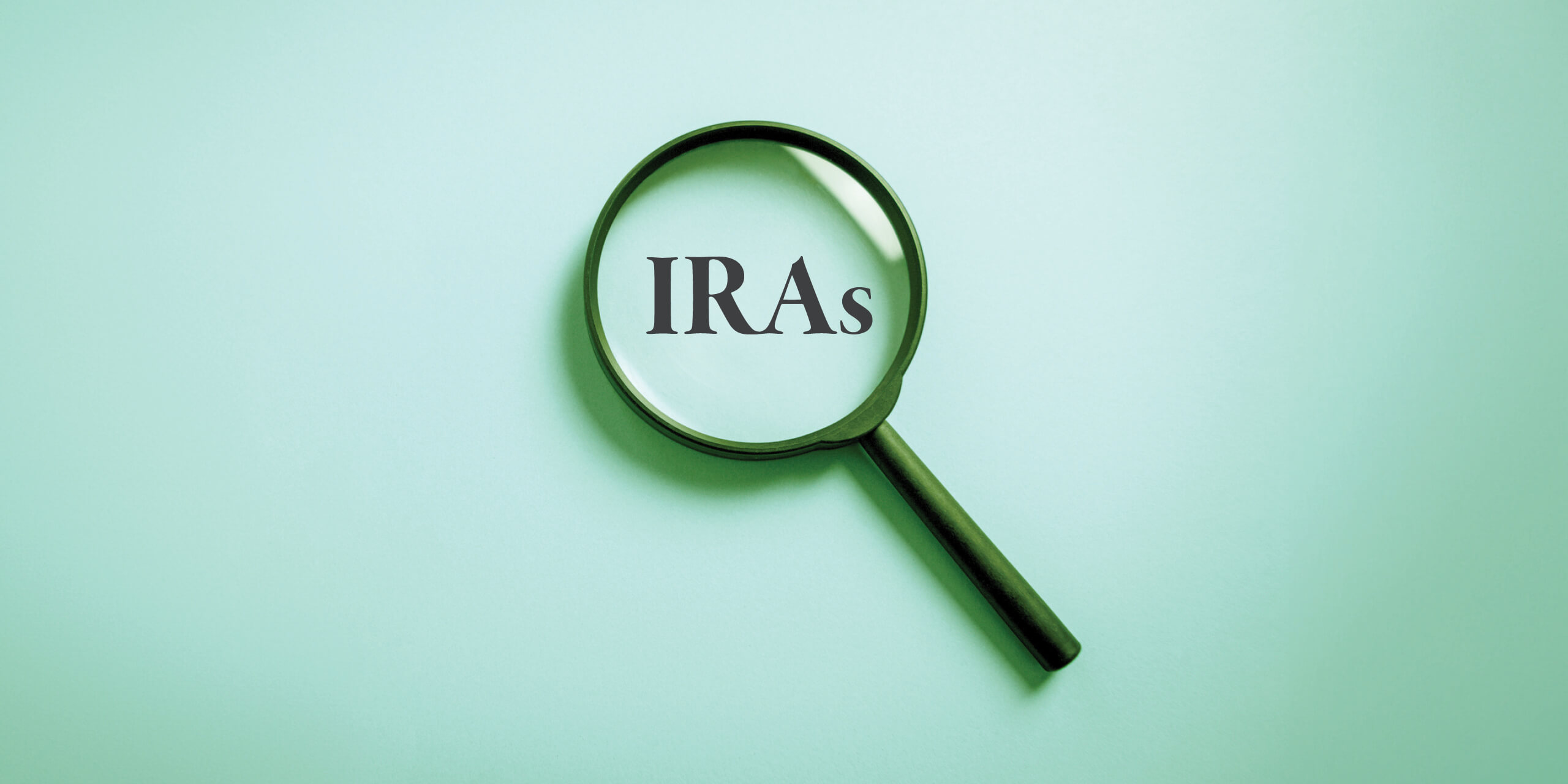 Magnify glass examining IRAs text