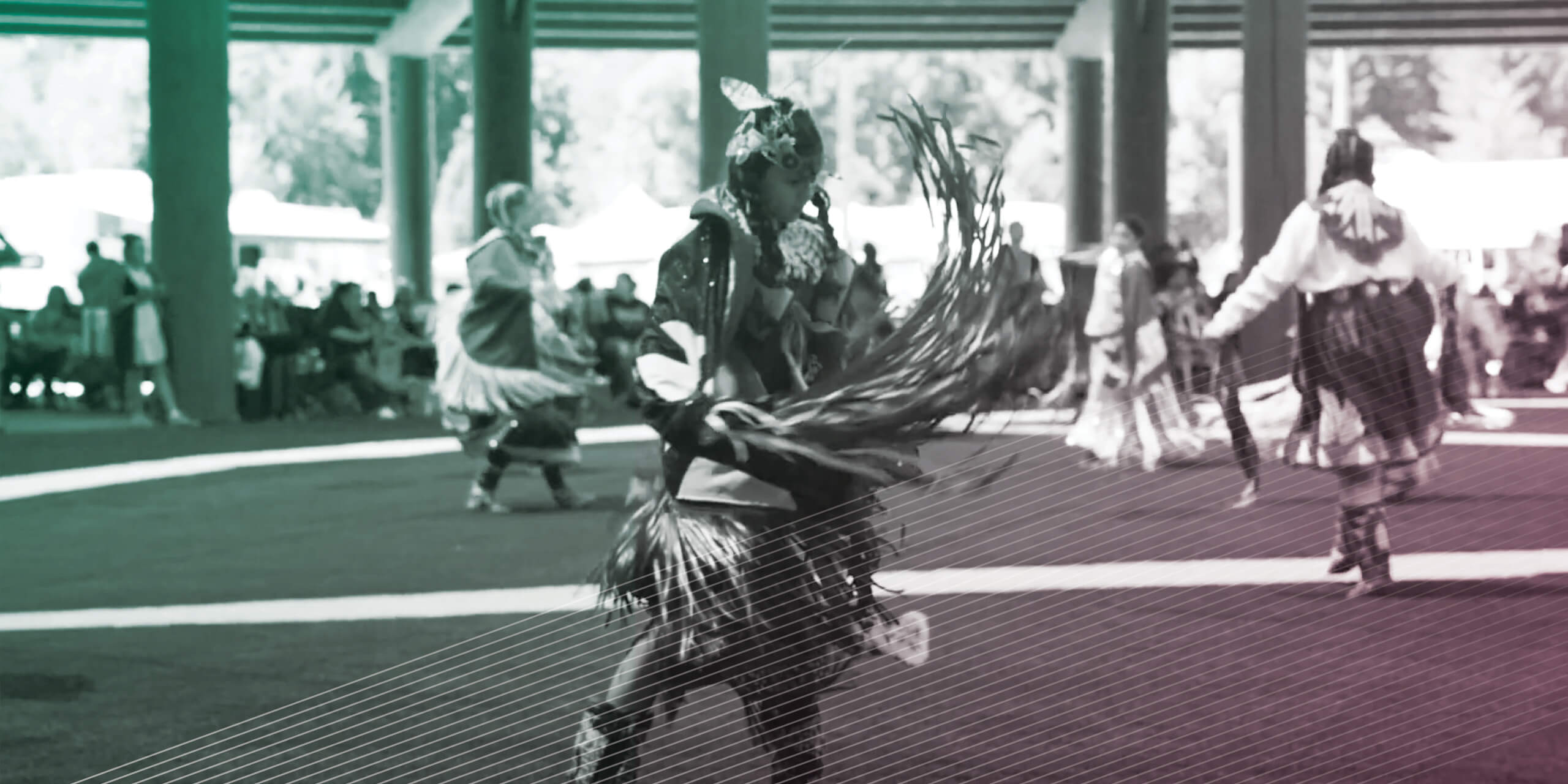 Native Americans dancing in traditional dress