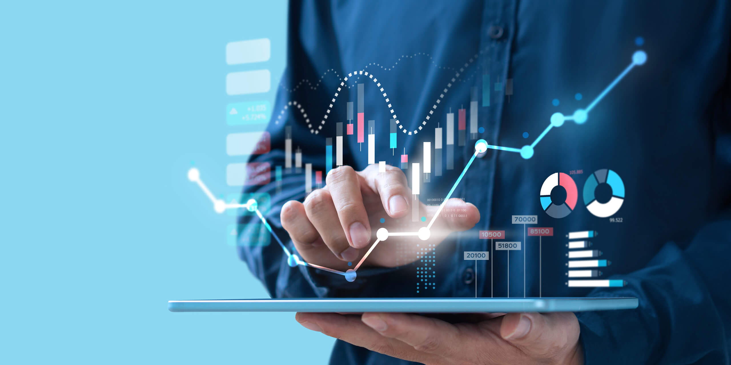 Man using tablet with overlay of graphs